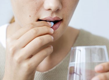 Woman taking medication